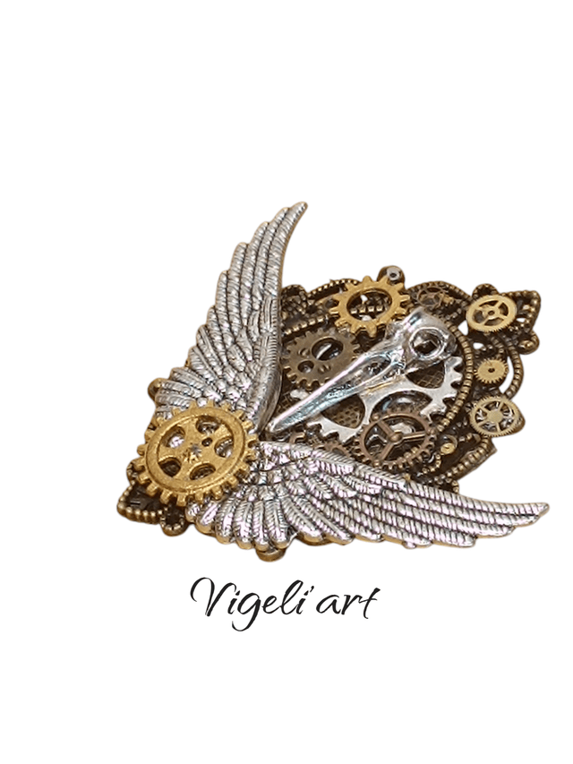 Broche ovale crâne d'oiseaux 
